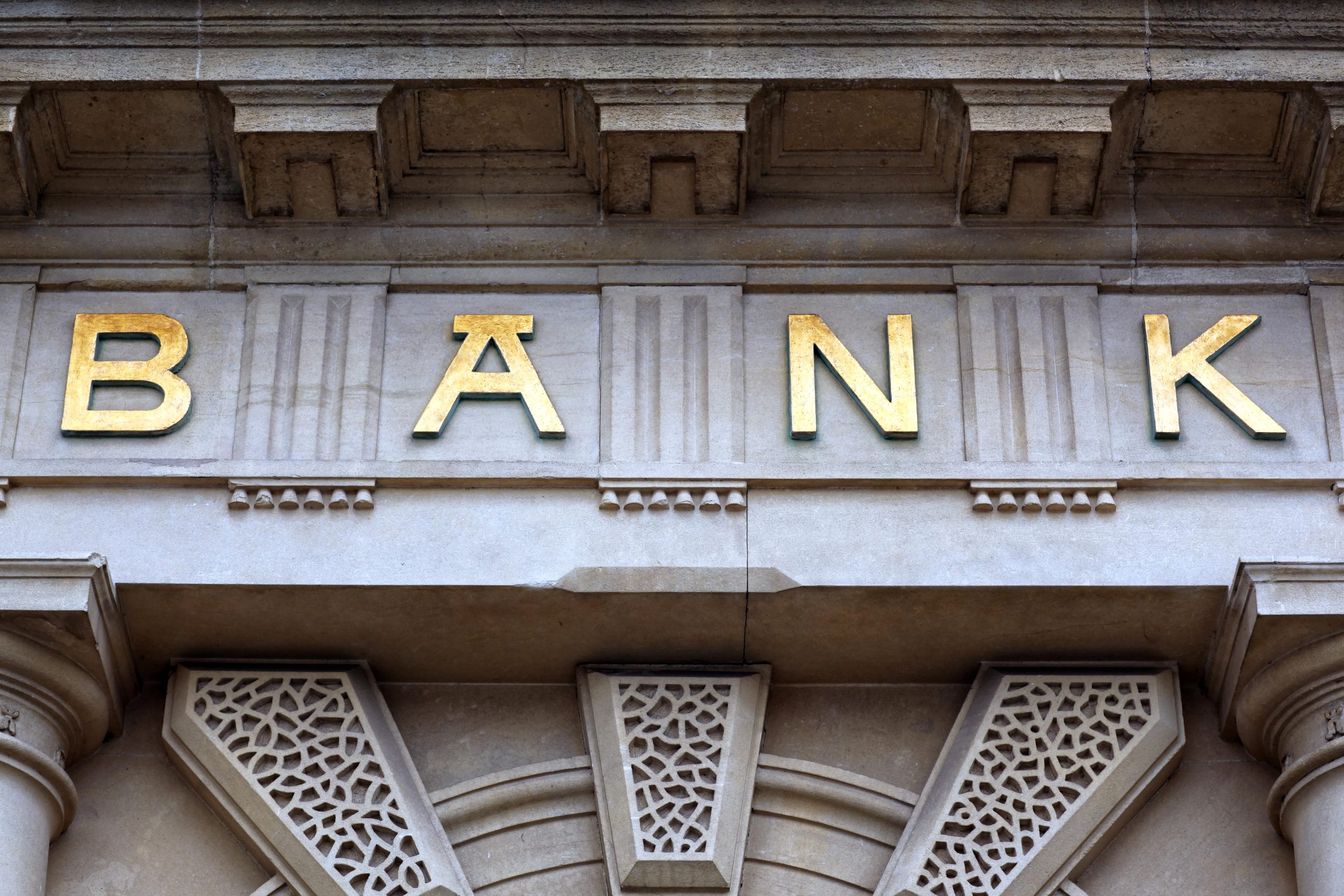 Bank sign above the door of financial building